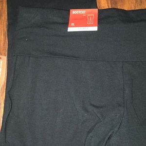 Black boot cut yogi pants .